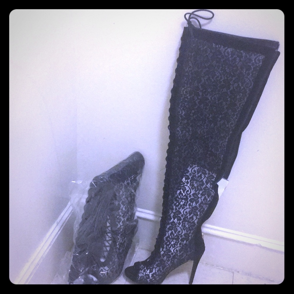 Thigh high, opened toed stilettos.